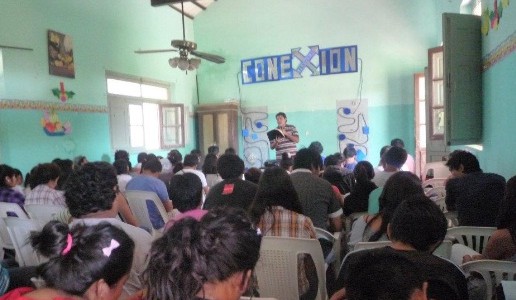 Pastor Nicolas teaching the children at camp.